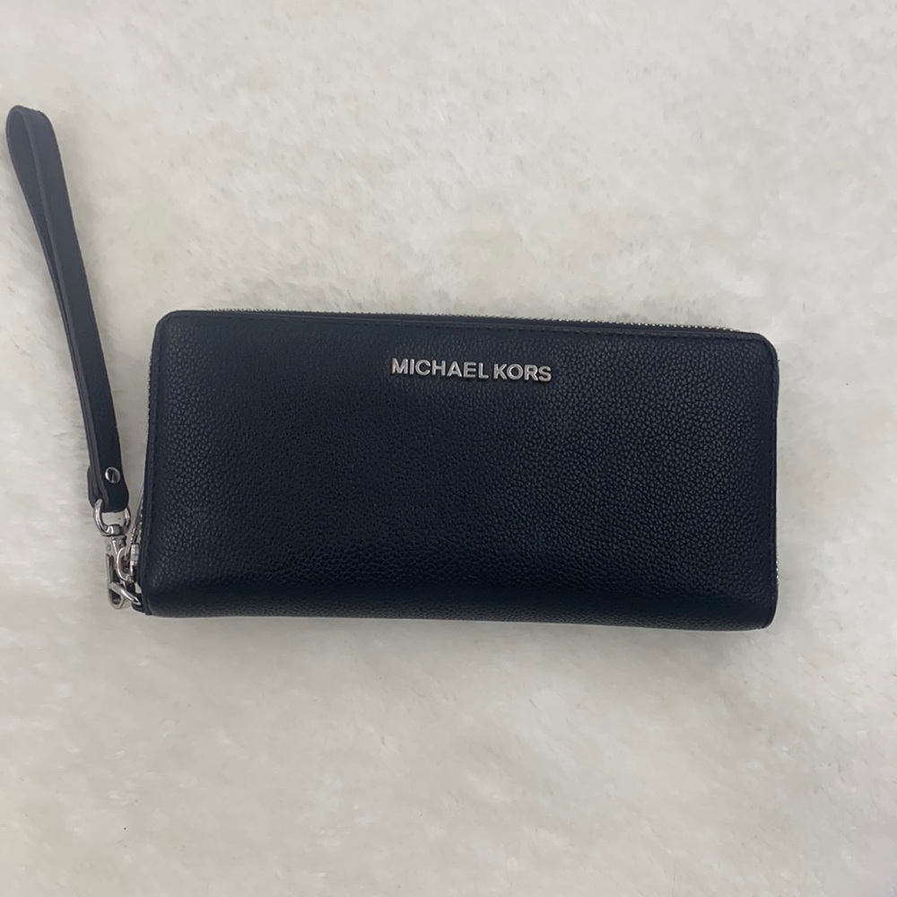Like New MK clutch with silver trim